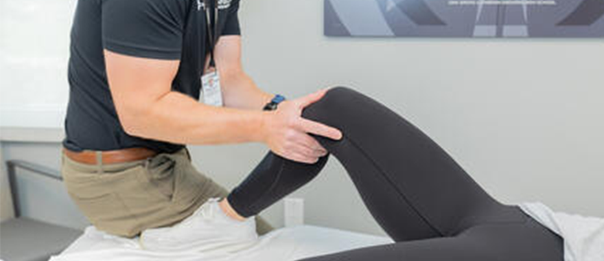 Physical Therapist working on knee injury